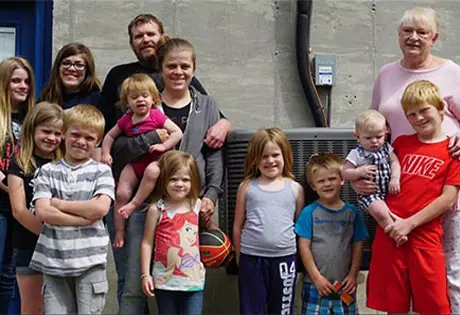 A family photo with 13 members