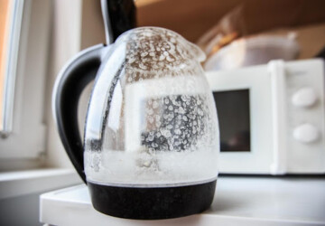 Hard water spots on a kettle in a kitchen.